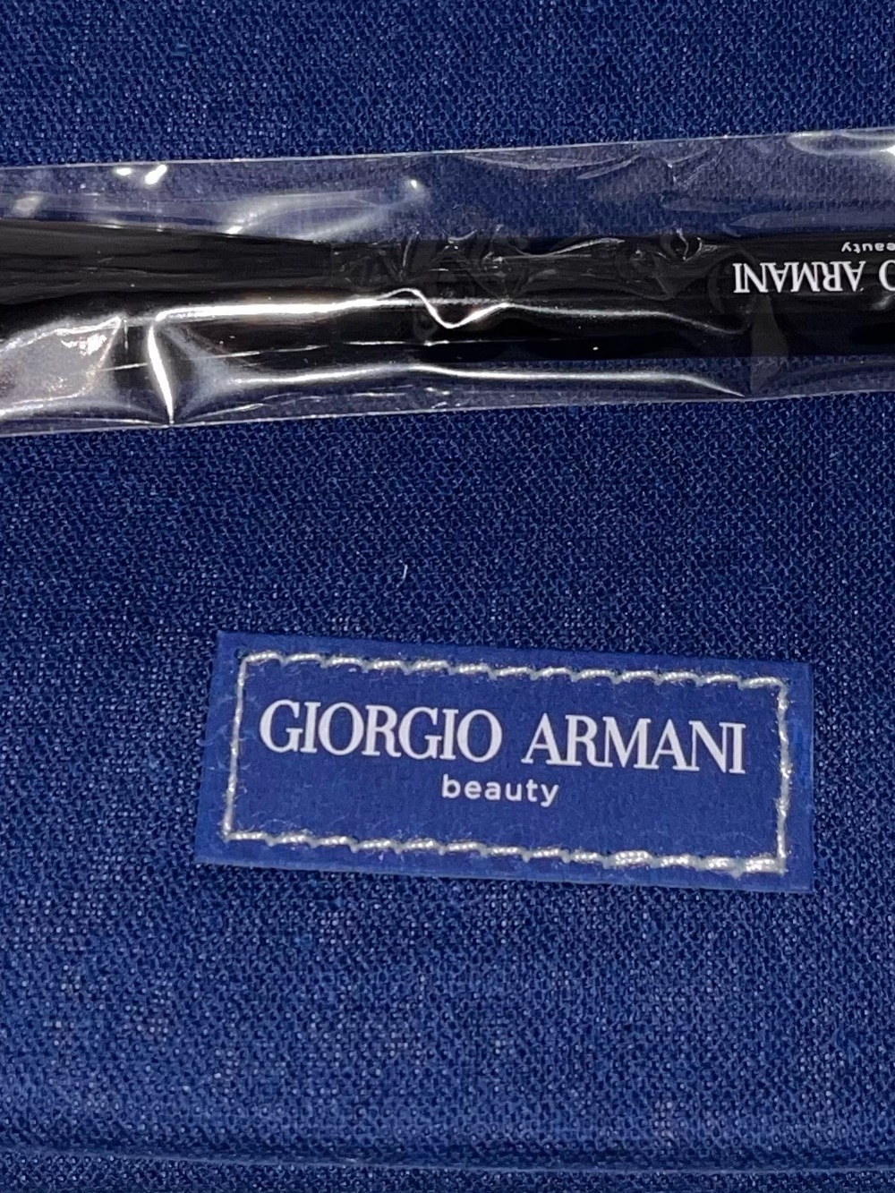 Giorgio Armani Black Makeup Brush on Blue Pouch